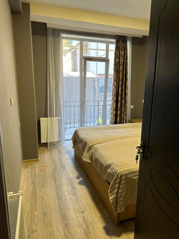 Postel nebo postele na pokoji v ubytování Memory- borjomi