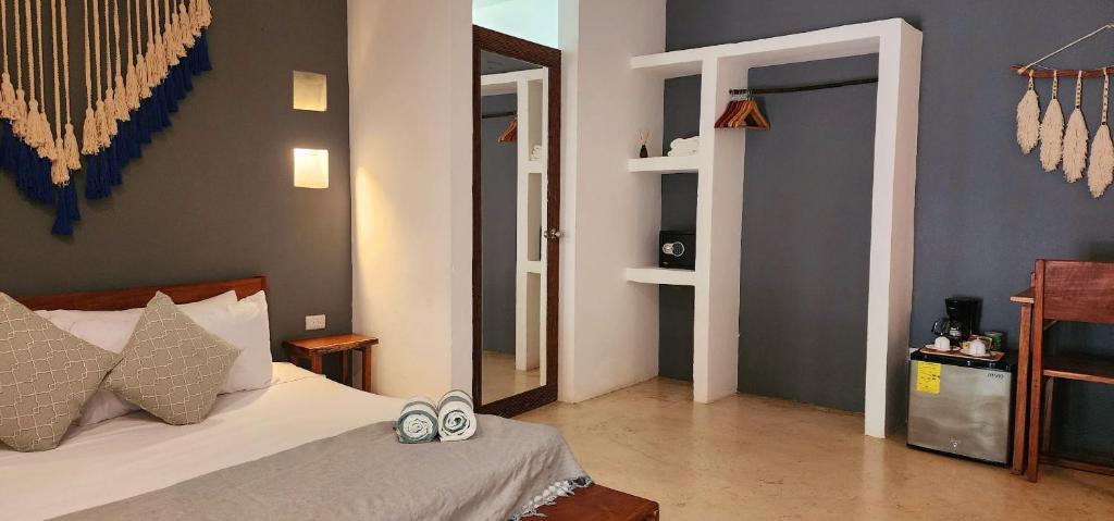 Postel nebo postele na pokoji v ubytování Hotel Kin Tulum Jungle Deluxe