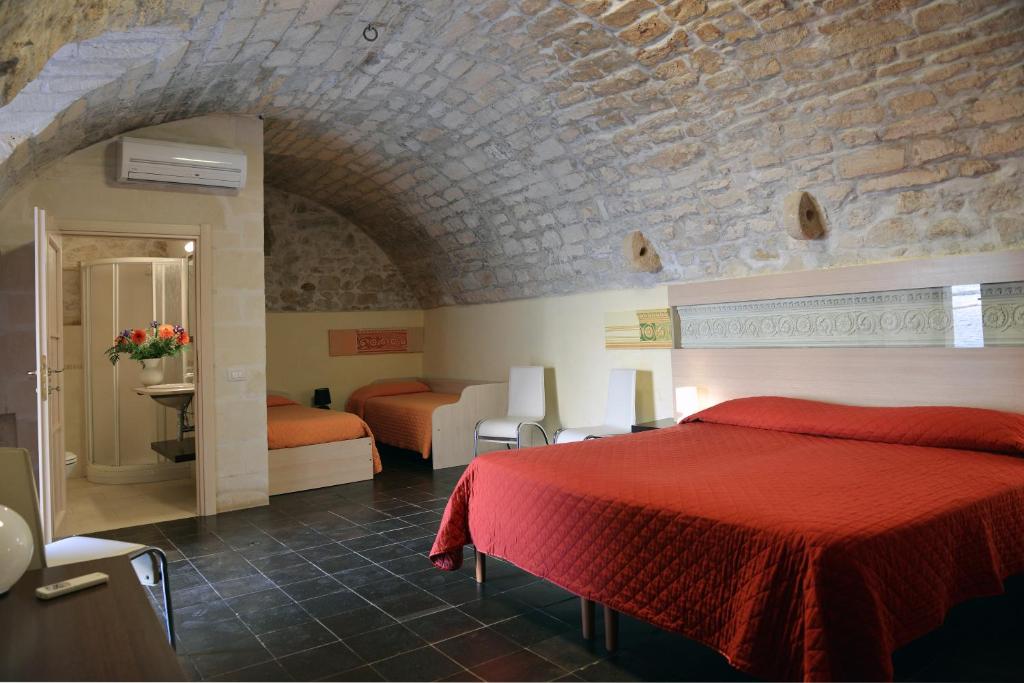 Postel nebo postele na pokoji v ubytování Relais Cimillà B&B