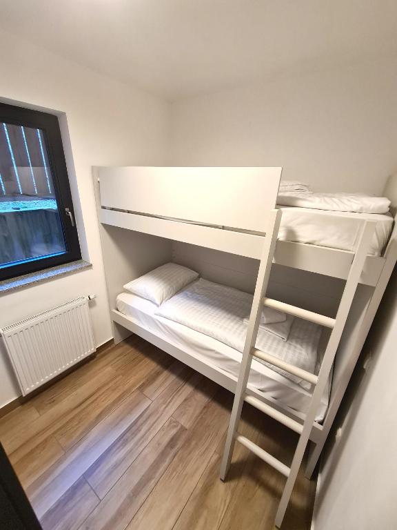 Voodi või voodid majutusasutuse Alpine Escape Golte Apartment toas