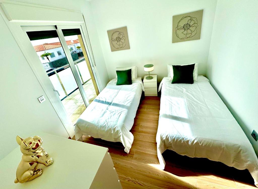 a room with two beds and a teddy bear on a table at Golf villa heated pool relax tenerife south in San Miguel de Abona