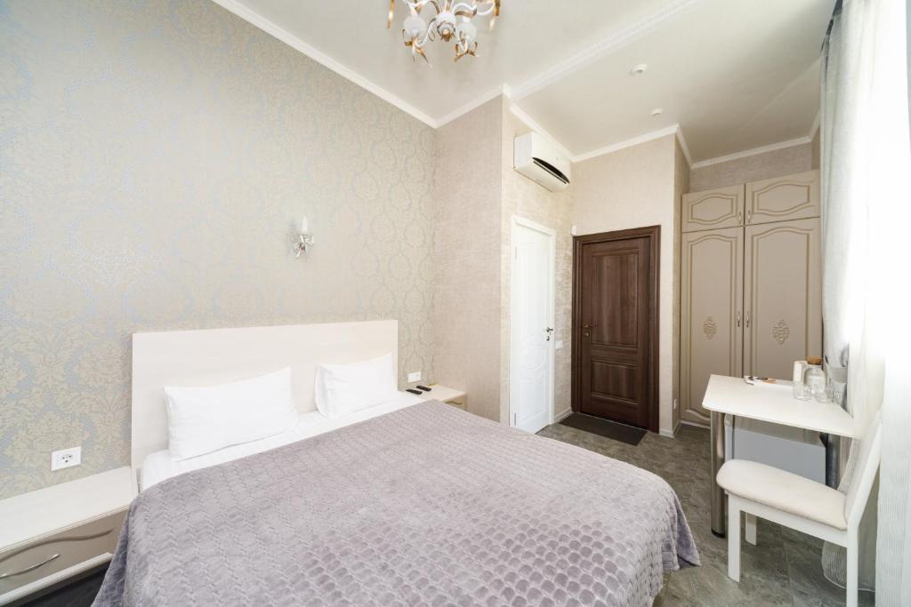 Postel nebo postele na pokoji v ubytování L.O.Y Family Hotel