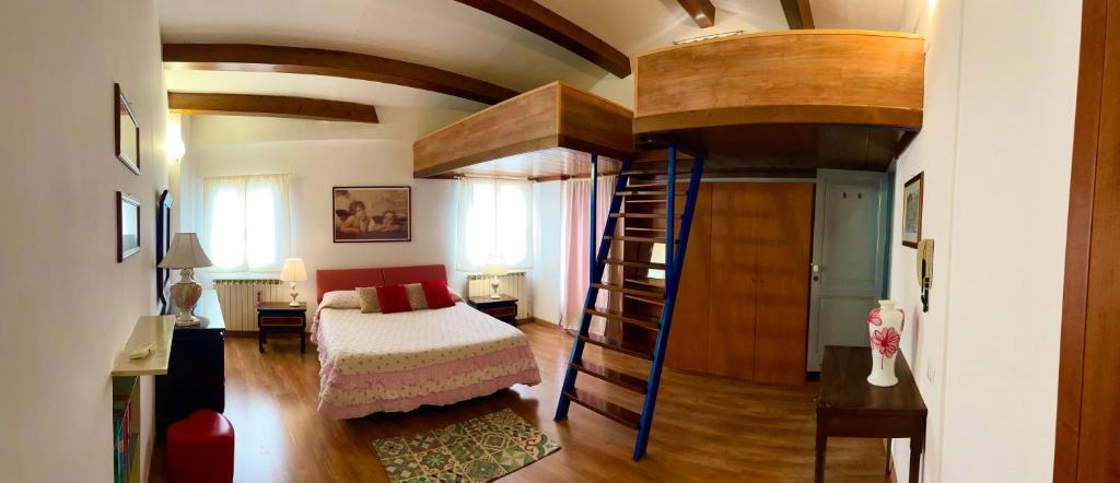 a bedroom with a bunk bed in a room at The Lovely House in Perugia