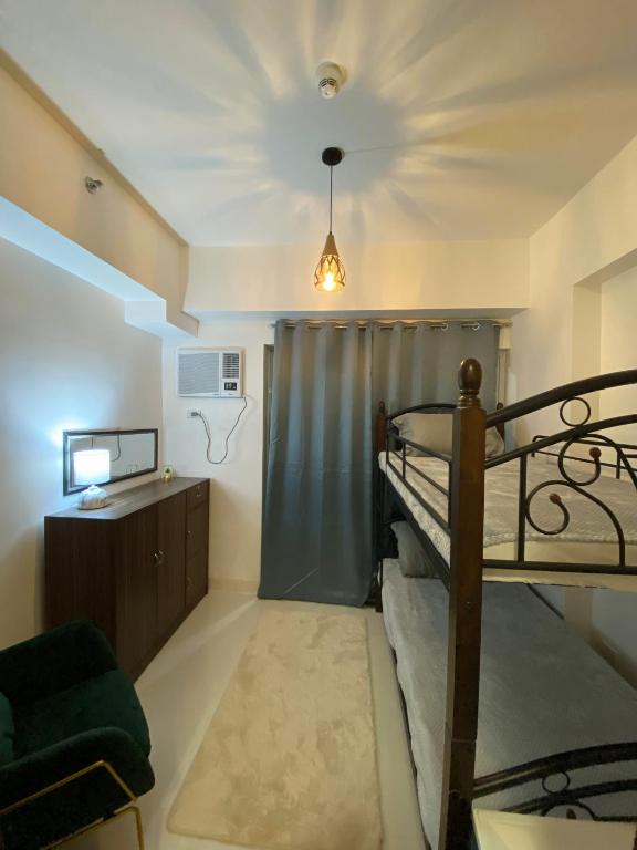 Postel nebo postele na pokoji v ubytování Moldex residences Silang
