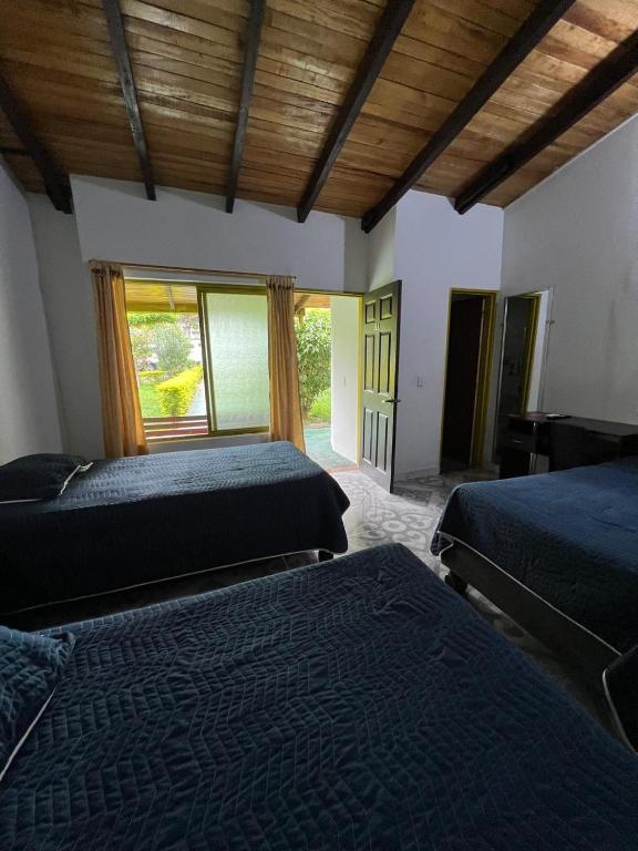 Postel nebo postele na pokoji v ubytování Hotel Villa Bosco