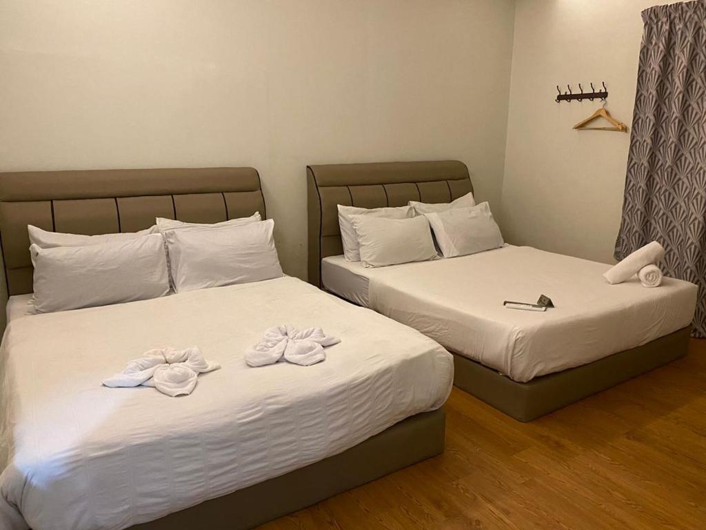 Postel nebo postele na pokoji v ubytování LE dEON HOTEL Former Pine Hotel