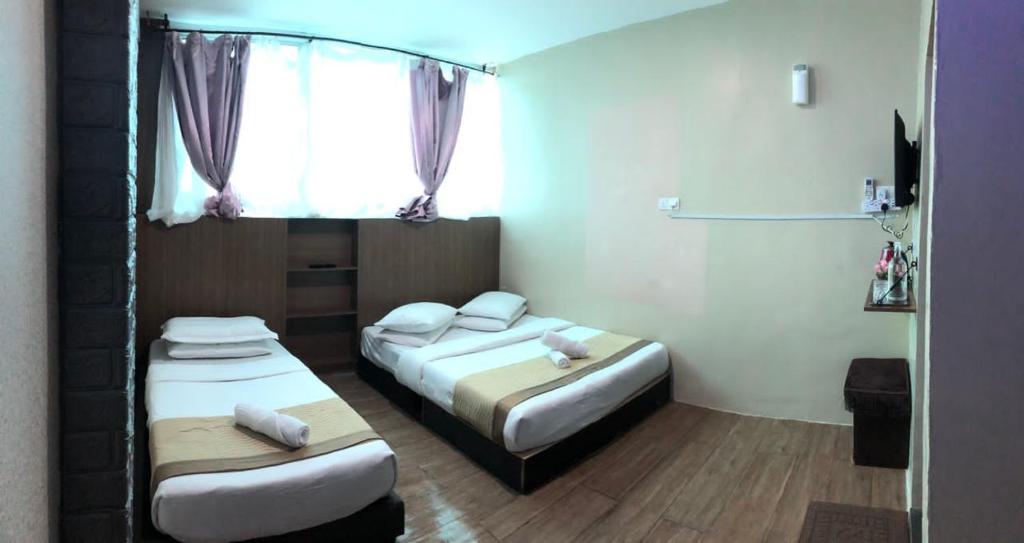 Postel nebo postele na pokoji v ubytování LE dEON HOTEL Former Pine Hotel