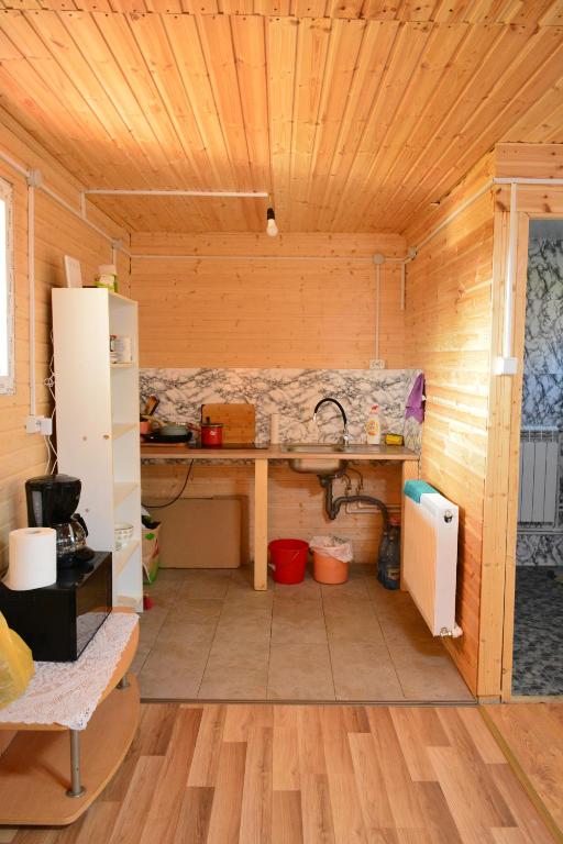 Kuchyň nebo kuchyňský kout v ubytování Cabana IBU