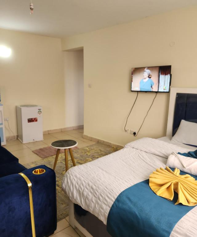 Postel nebo postele na pokoji v ubytování Kiserian Comfort