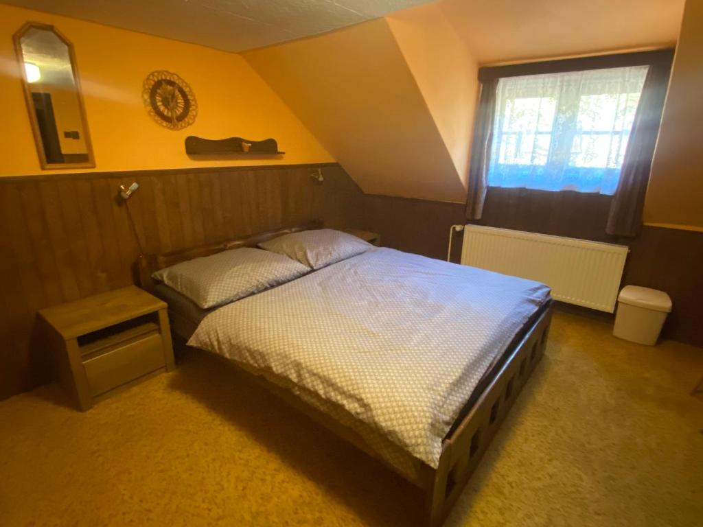 Postel nebo postele na pokoji v ubytování Penzion Starý Mlýn