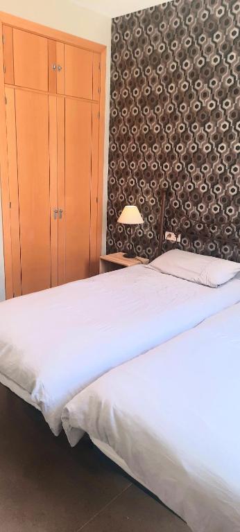 Postel nebo postele na pokoji v ubytování Apartamentos MalagaSol
