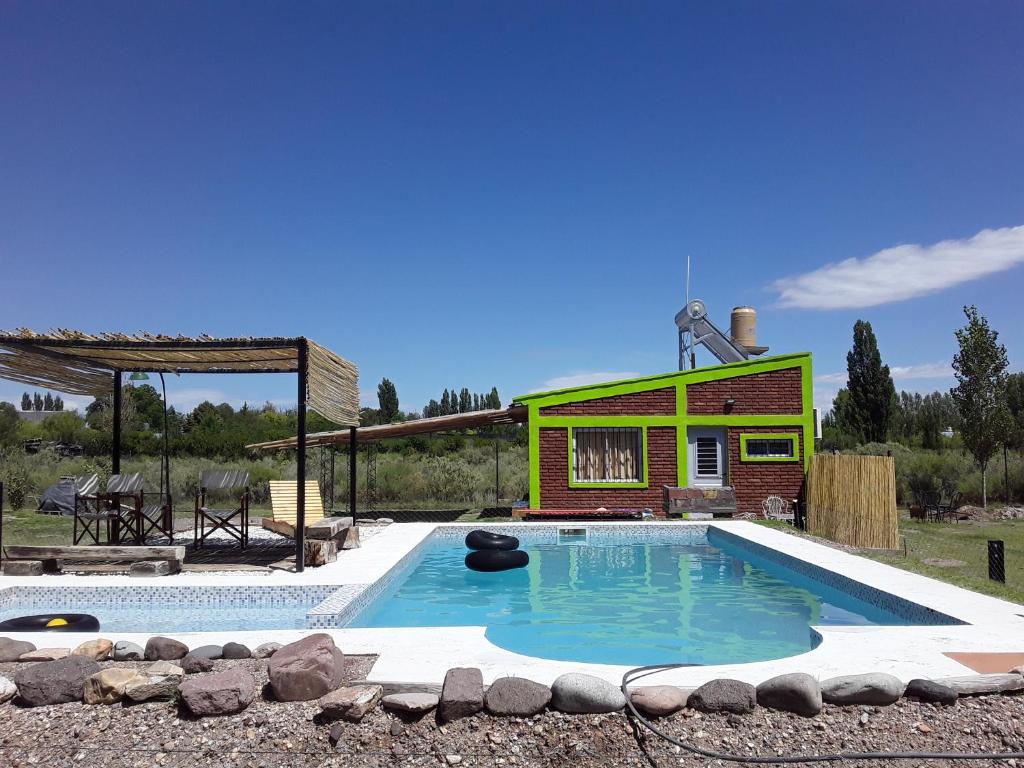 a swimming pool in front of a house at Don Emi in San Rafael