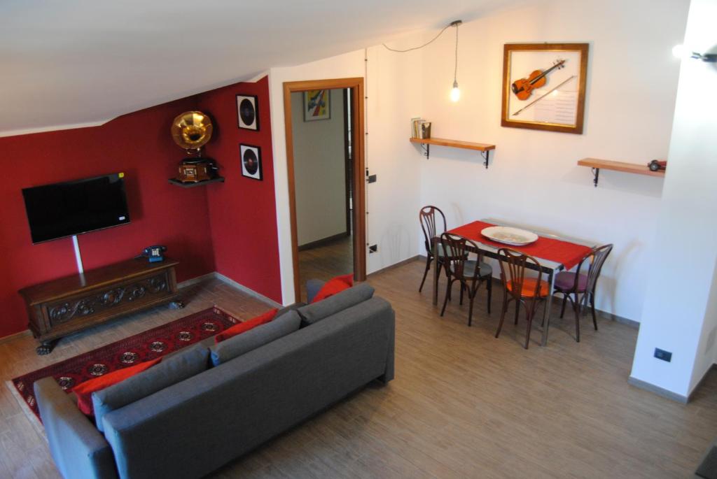 a living room with a couch and a table at Vintage Apartment in Caselle Torinese