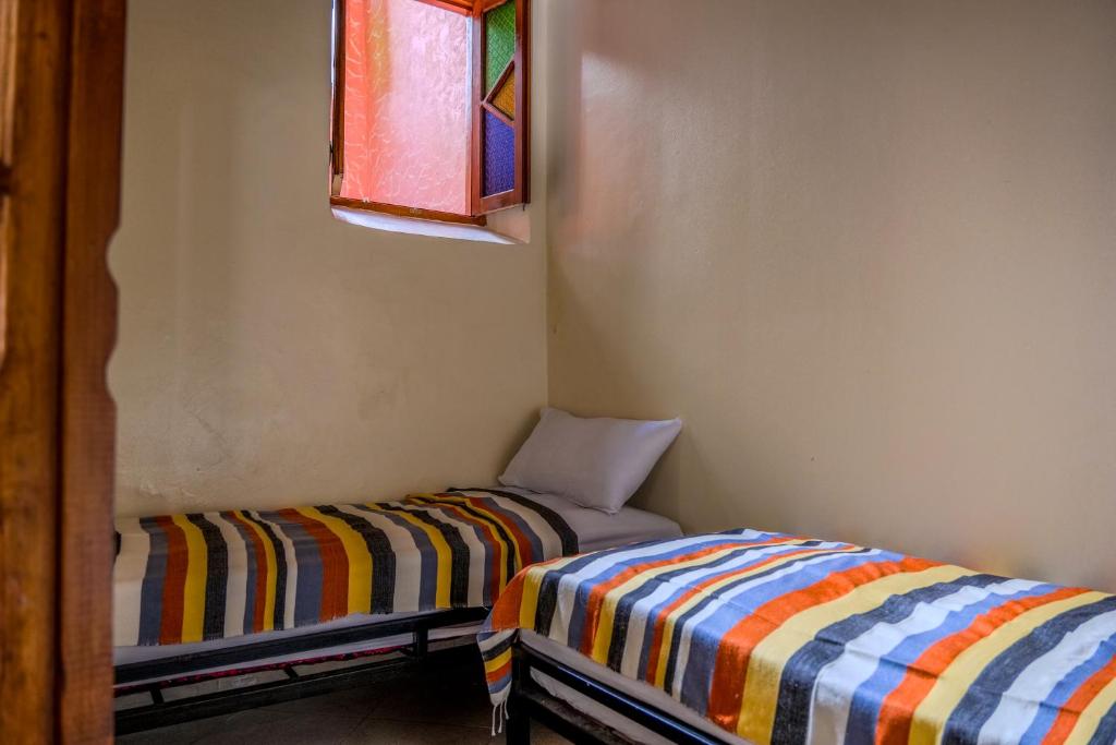 Voodi või voodid majutusasutuse Yakout hostel toas