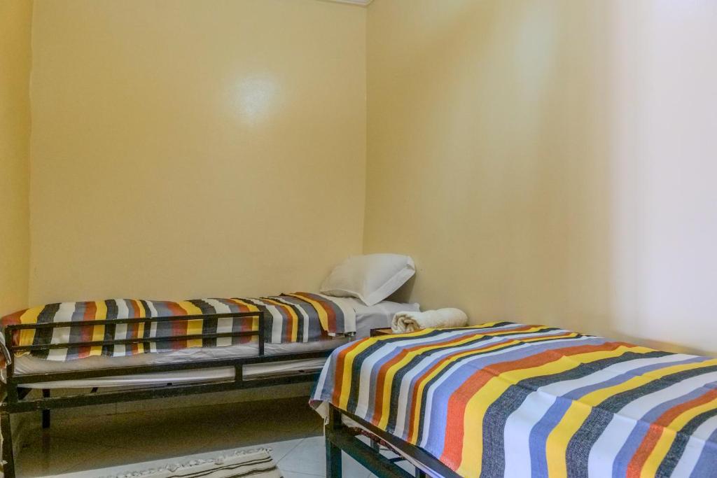 Voodi või voodid majutusasutuse Yakout hostel toas