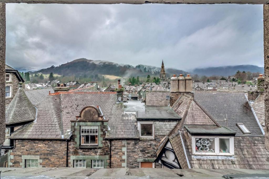 an aerial view of a city with roofs at Ambleside Central in Ambleside