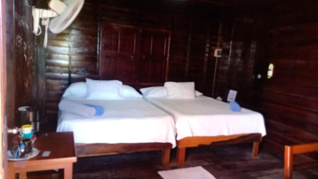 Postel nebo postele na pokoji v ubytování Cabañas El Cuyo