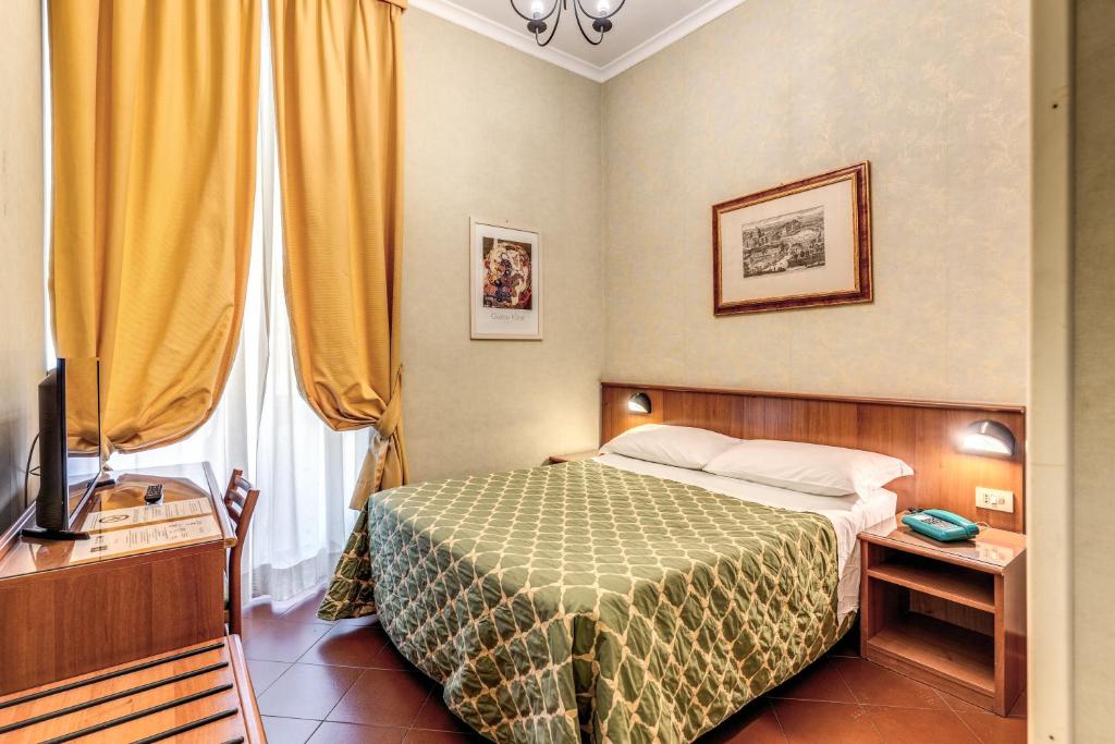 Postel nebo postele na pokoji v ubytování Hotel Corona