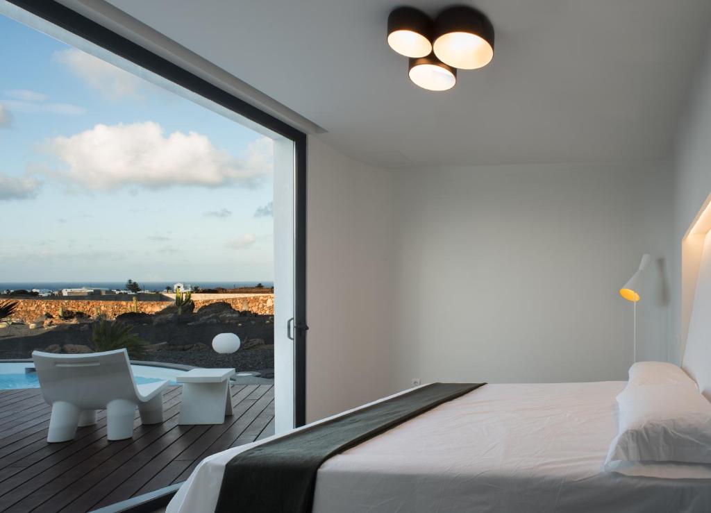 Postel nebo postele na pokoji v ubytování VULKANO Villas