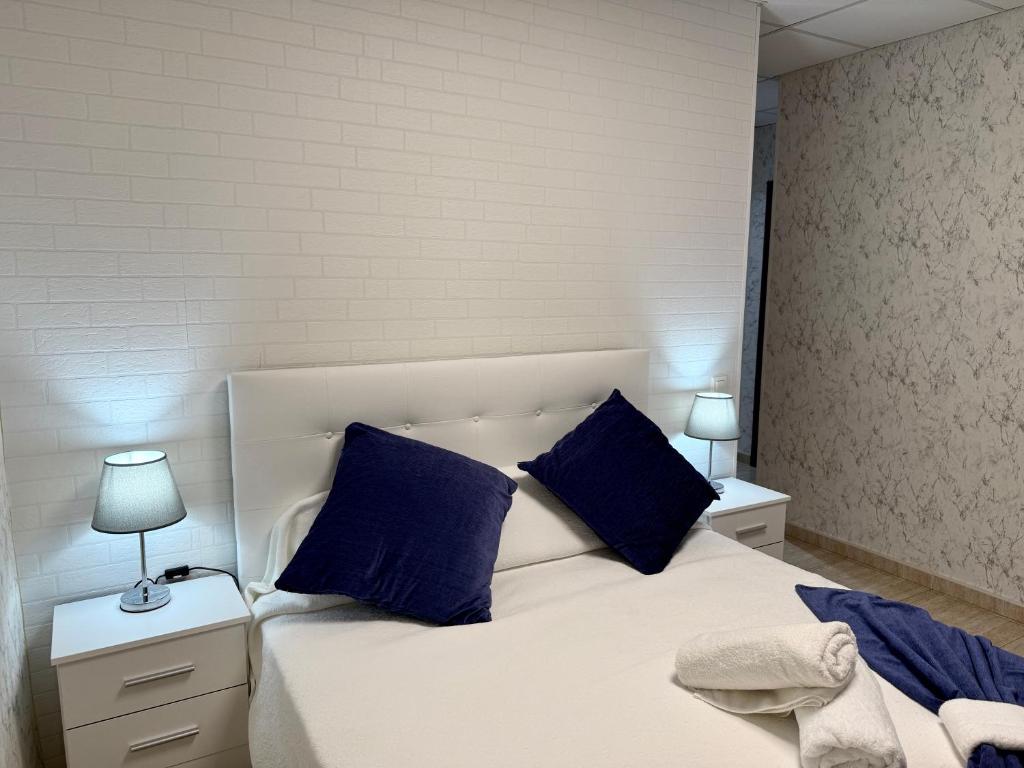 Postel nebo postele na pokoji v ubytování Hotel Sancho