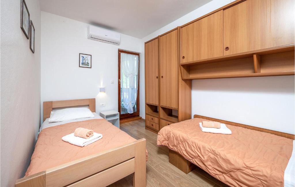 Postel nebo postele na pokoji v ubytování Apartment Labin 22 With Outdoor Swimmingpool