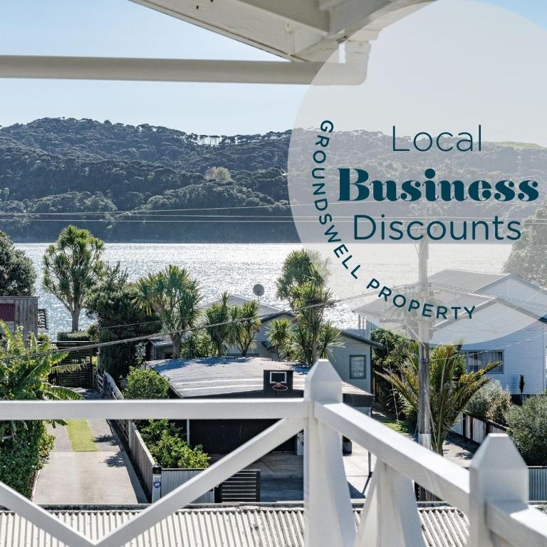 a view of the water from the balcony of a house at Harbourside Cove, Water Views, Cosy, Peaceful in Raglan