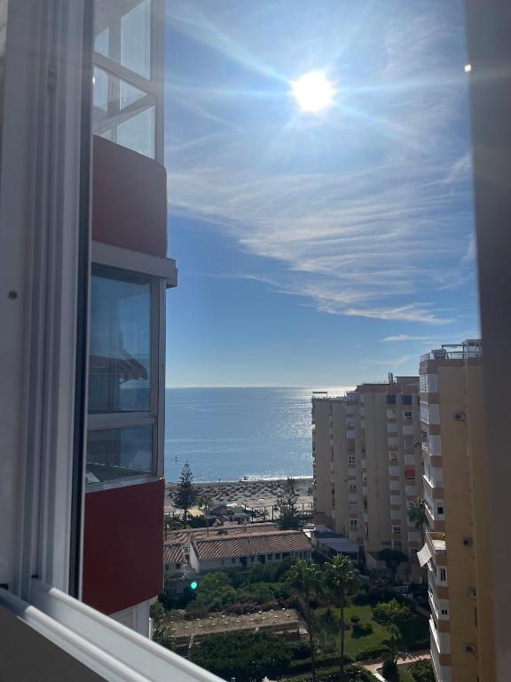 a view of the ocean from a window of a building at Estudio Zurycris in Torrox Costa
