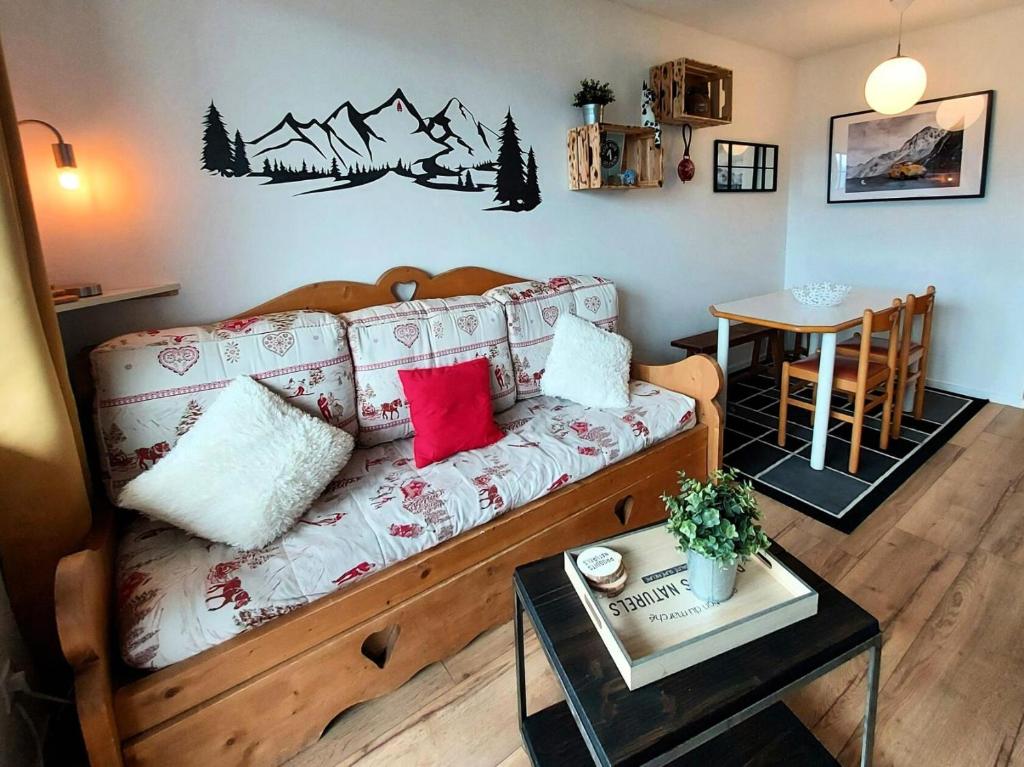 a living room with a couch and a table at Résidence Le Sextant - SEXTANT 304 MAE-0871 in La Plagne Tarentaise