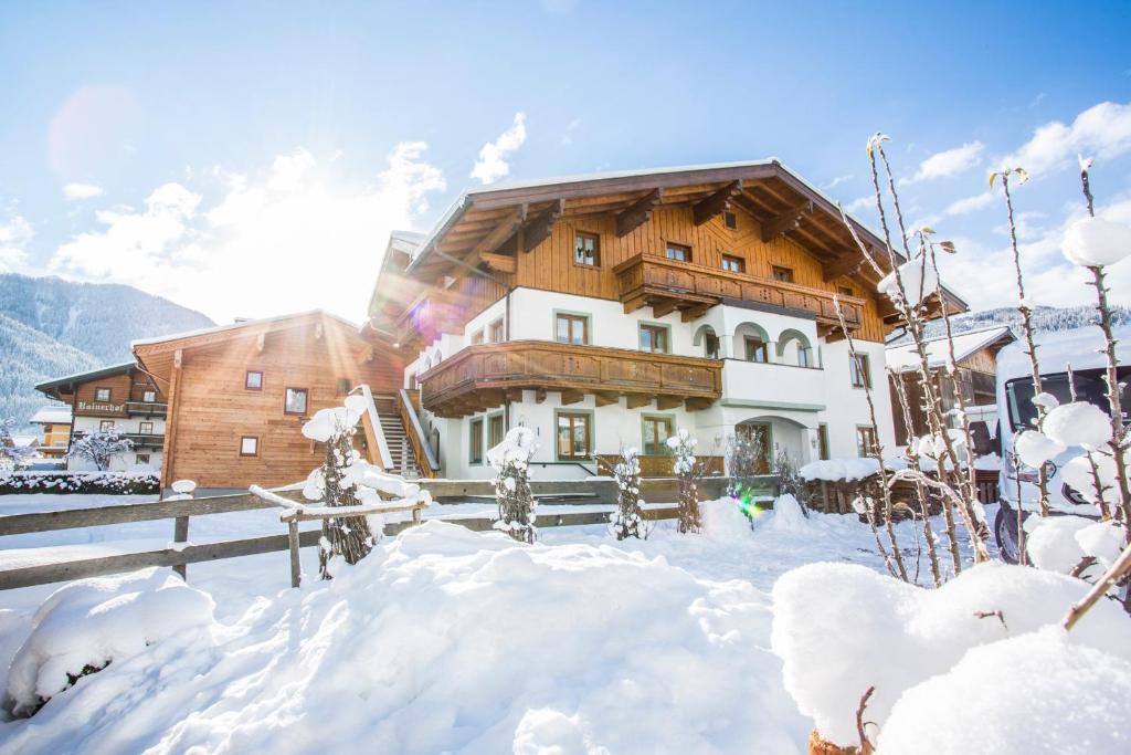 a house in the snow with snow covered at Ausserraingut in Flachau