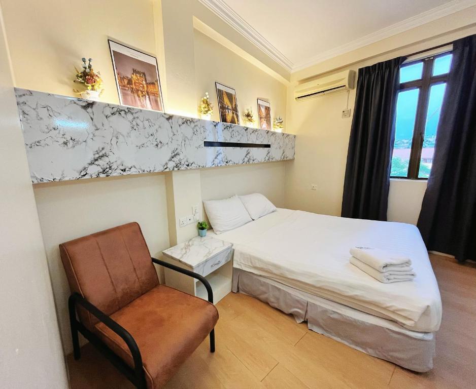 Postel nebo postele na pokoji v ubytování Fair Park Hotel