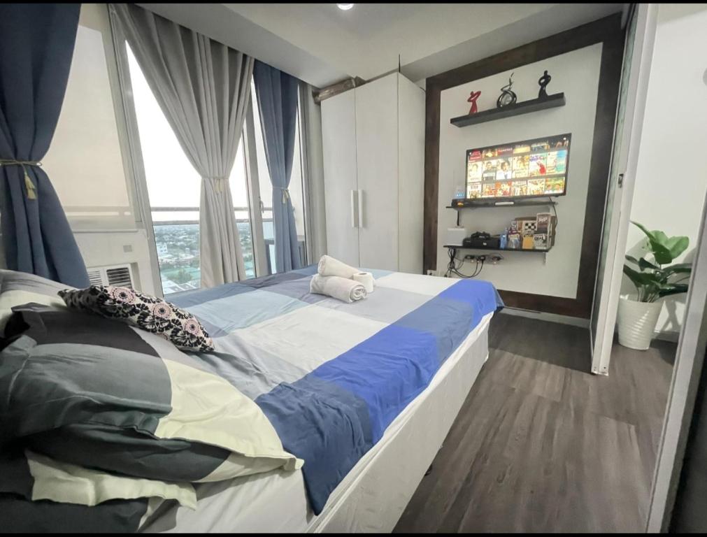 Postel nebo postele na pokoji v ubytování Azure Urban Resort with WIFI and Netflix