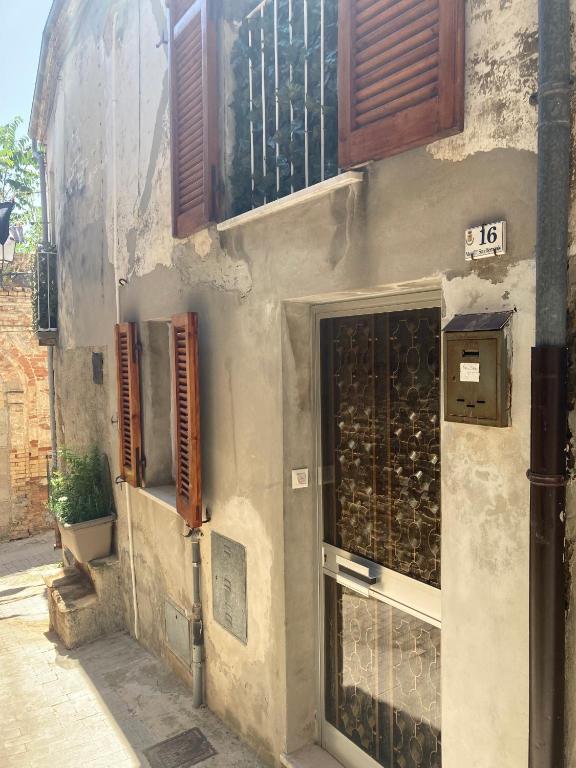 a facade of a building with a door and windows at Casa Il Muro in Citta' Sant'Angelo