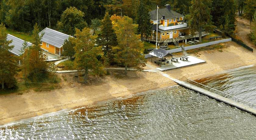 an aerial view of a house next to a body of water at Årsunda Strandbad Sjösunda vandrarhem in Årsunda