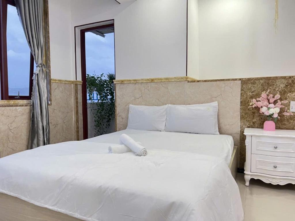 Giường trong phòng chung tại Anna Luxury Apartment