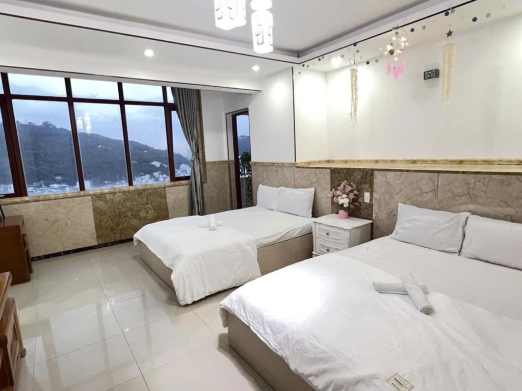 Giường trong phòng chung tại Anna Luxury Apartment