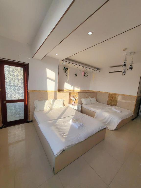 Postel nebo postele na pokoji v ubytování Thúy Hạnh Homestay