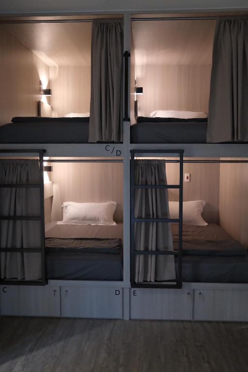 Postel nebo postele na pokoji v ubytování Yukwanhai Hostel