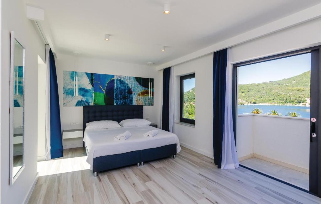 Posteľ alebo postele v izbe v ubytovaní Four-Bedroom Holiday Home In Zaton Mali