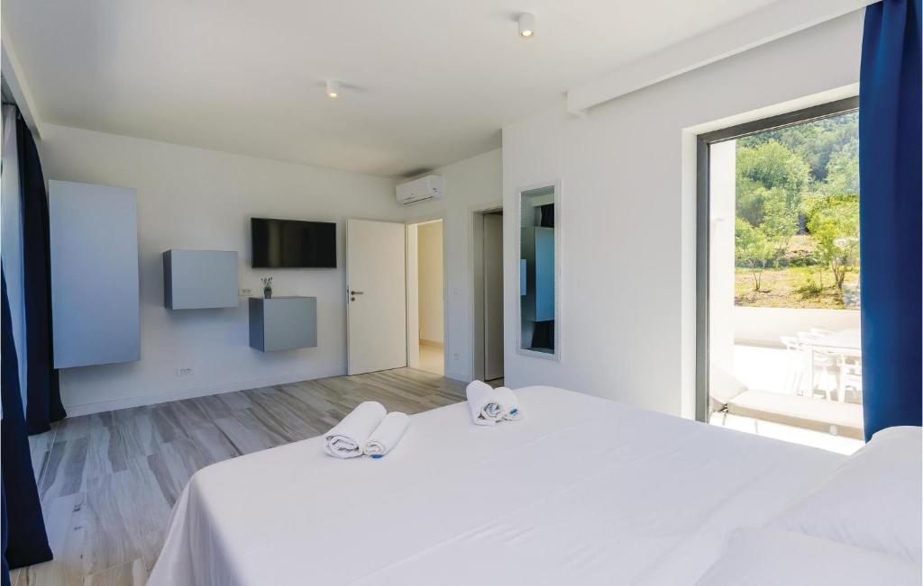 Posteľ alebo postele v izbe v ubytovaní Four-Bedroom Holiday Home In Zaton Mali