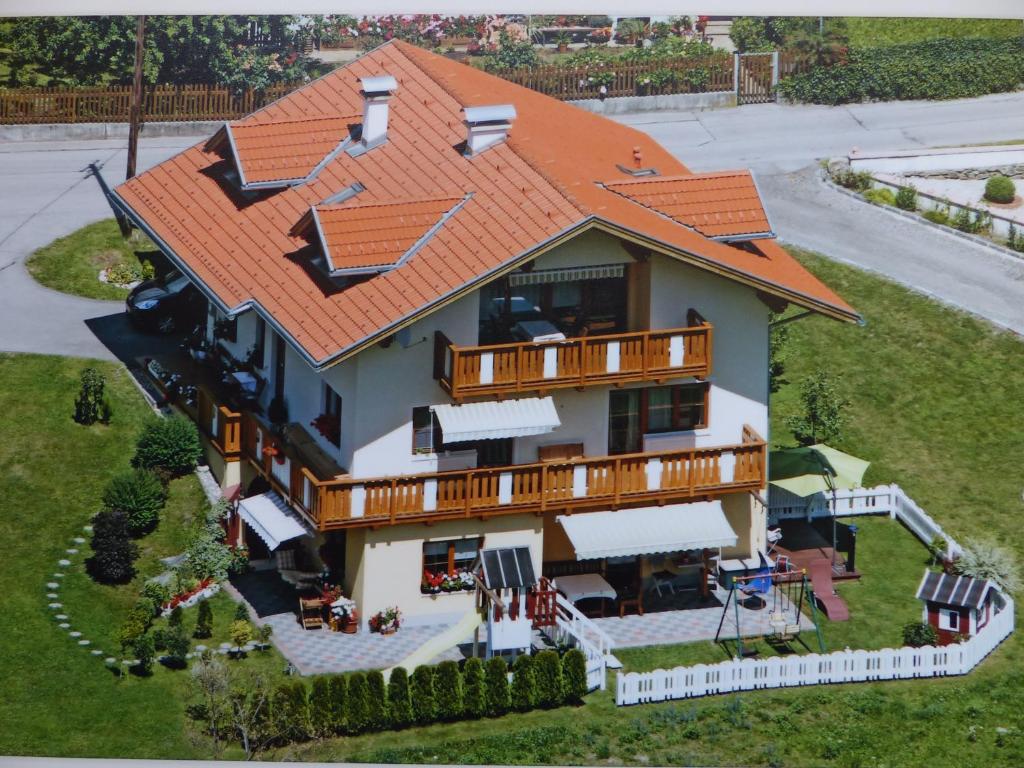 an overhead view of a house with an orange roof at Appartment Lukasser in Ainet