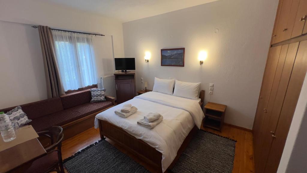 Postel nebo postele na pokoji v ubytování Πασιθεα mountain rooms
