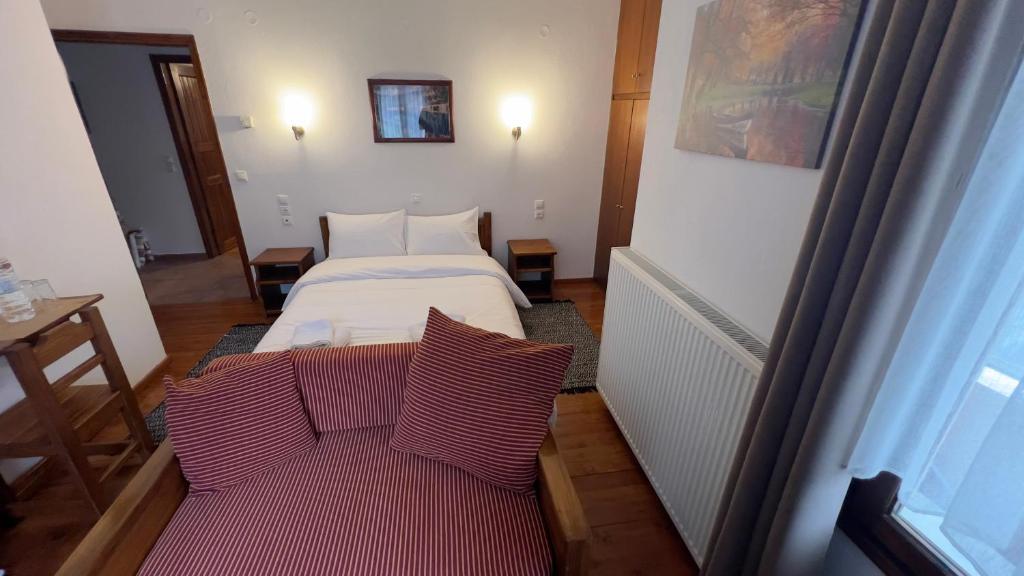 Postel nebo postele na pokoji v ubytování Πασιθεα mountain rooms