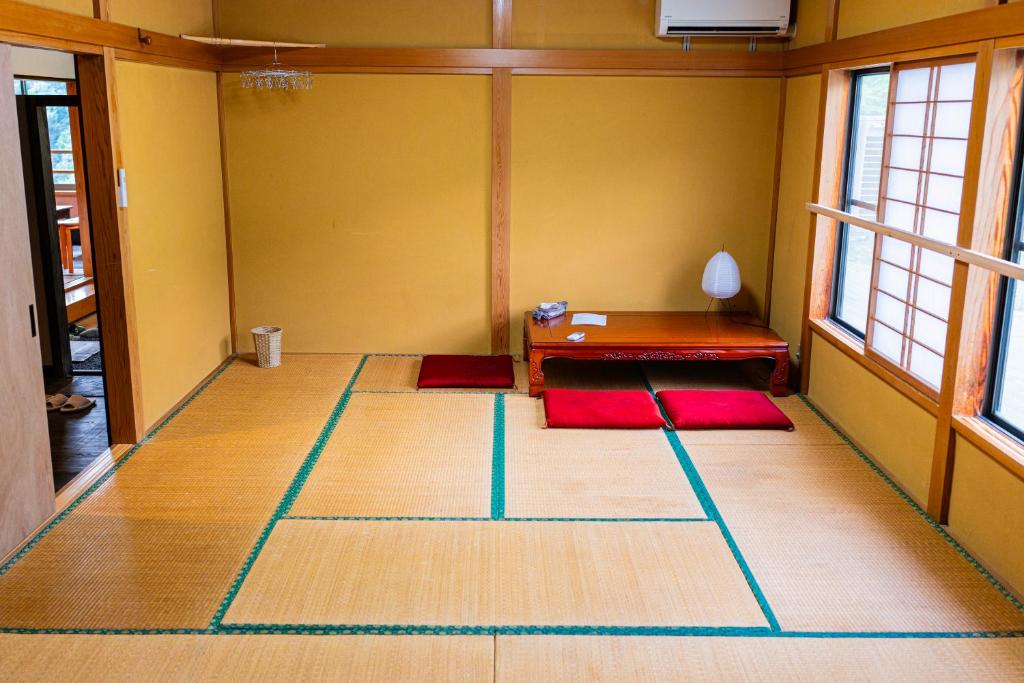 Postel nebo postele na pokoji v ubytování 清津峡Hostel 雪ふる宿