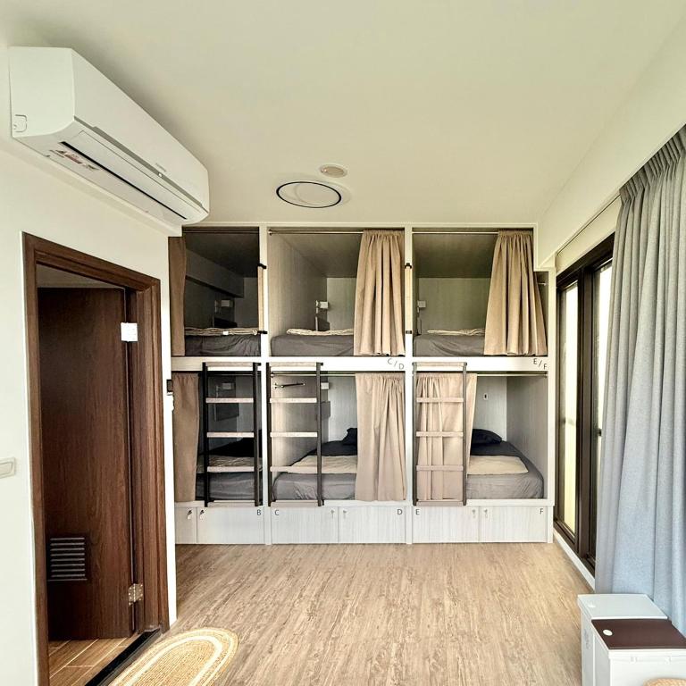 Postel nebo postele na pokoji v ubytování Yukwanhai Hostel