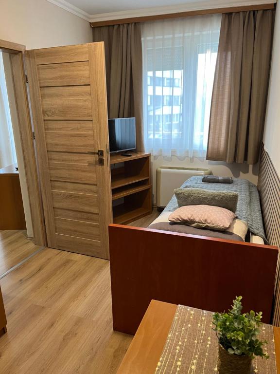 Posteľ alebo postele v izbe v ubytovaní Brookforest Apartman