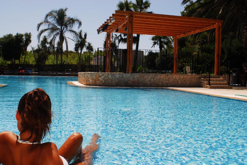 Bazén v ubytování Hotel Club Astor nebo v jeho okolí