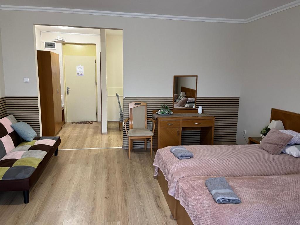 Posteľ alebo postele v izbe v ubytovaní Brookforest Apartman