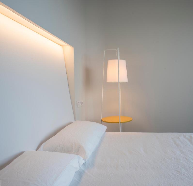 Postel nebo postele na pokoji v ubytování VULKANO Villas