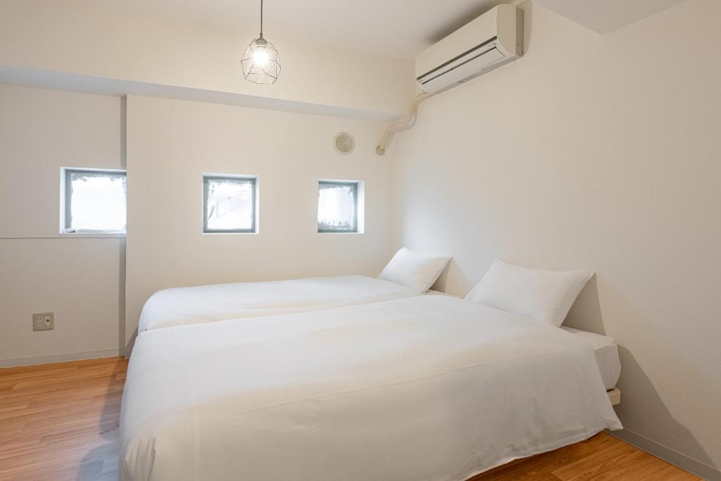 Voodi või voodid majutusasutuse 東新宿 1008 toas