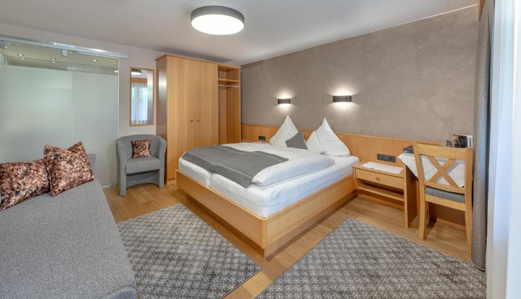 Postel nebo postele na pokoji v ubytování Hotel Thaler